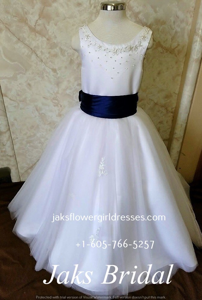 long white dress with blue sash